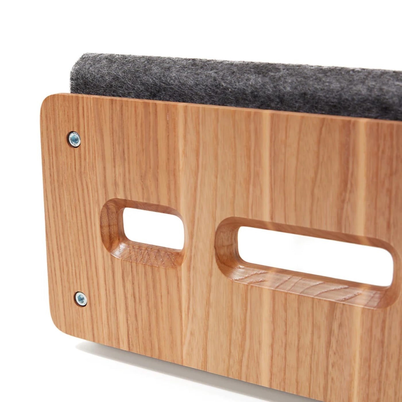 Close up of ergonomic wooden laptop stand side panel with felt padding and cut out handles