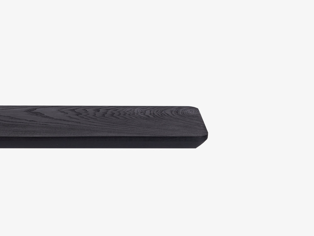 Black Ash I Close-up of monitor stand edge profile in white background