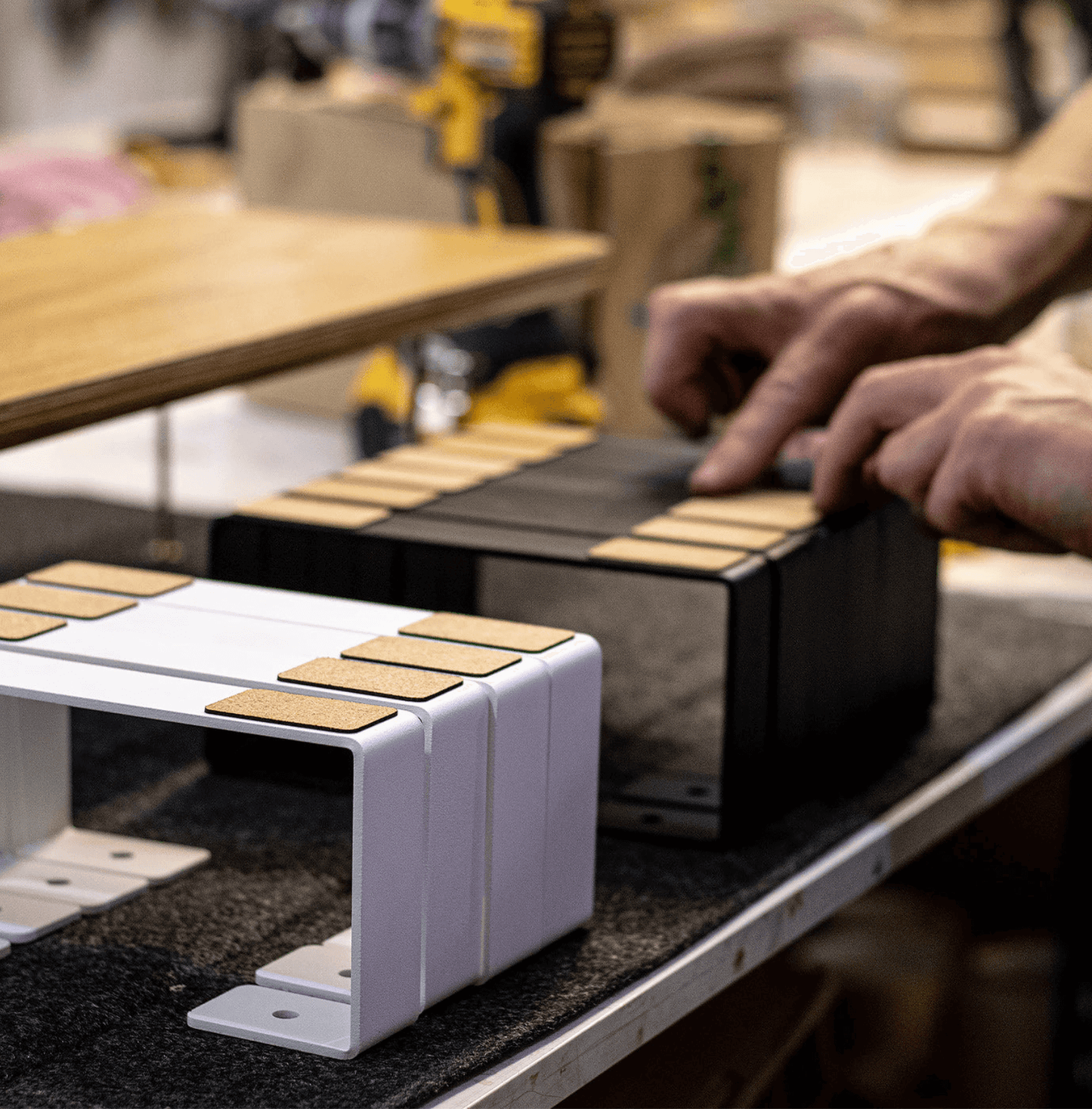 Iron legs for Kansoki Monitor stand being arrange by kansoki employee