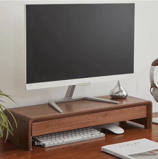 Wooden classic pro monitor stand with a computer monitor, keyboard, and mouse on a desk. Ergonomic monitor stand.