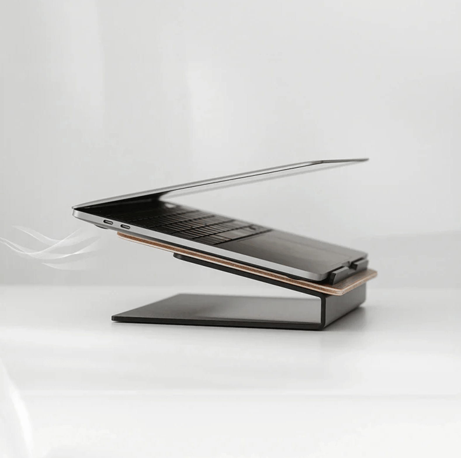 Ergonomic laptop wooden stand with cooling airflow, modern desk accessory