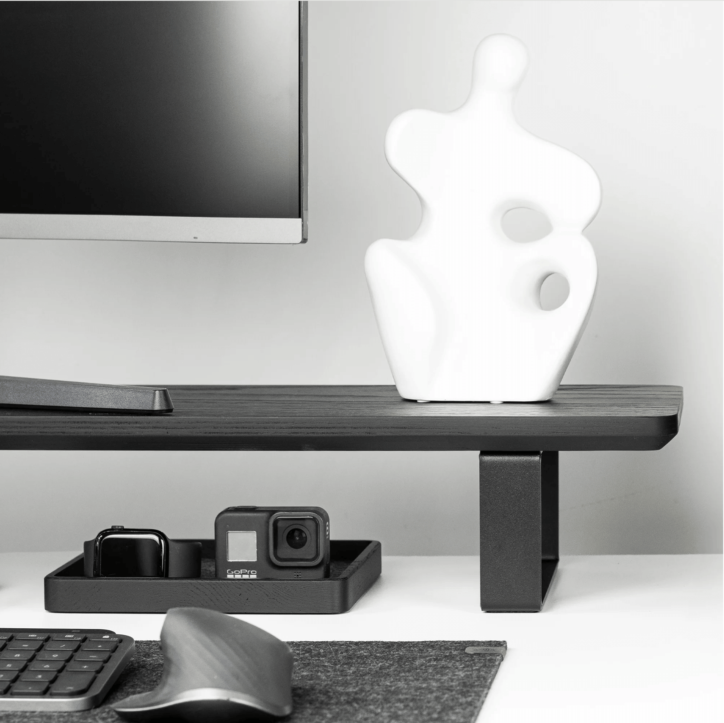 Black wooden Monitoe Stand side angle shot with storage underneath