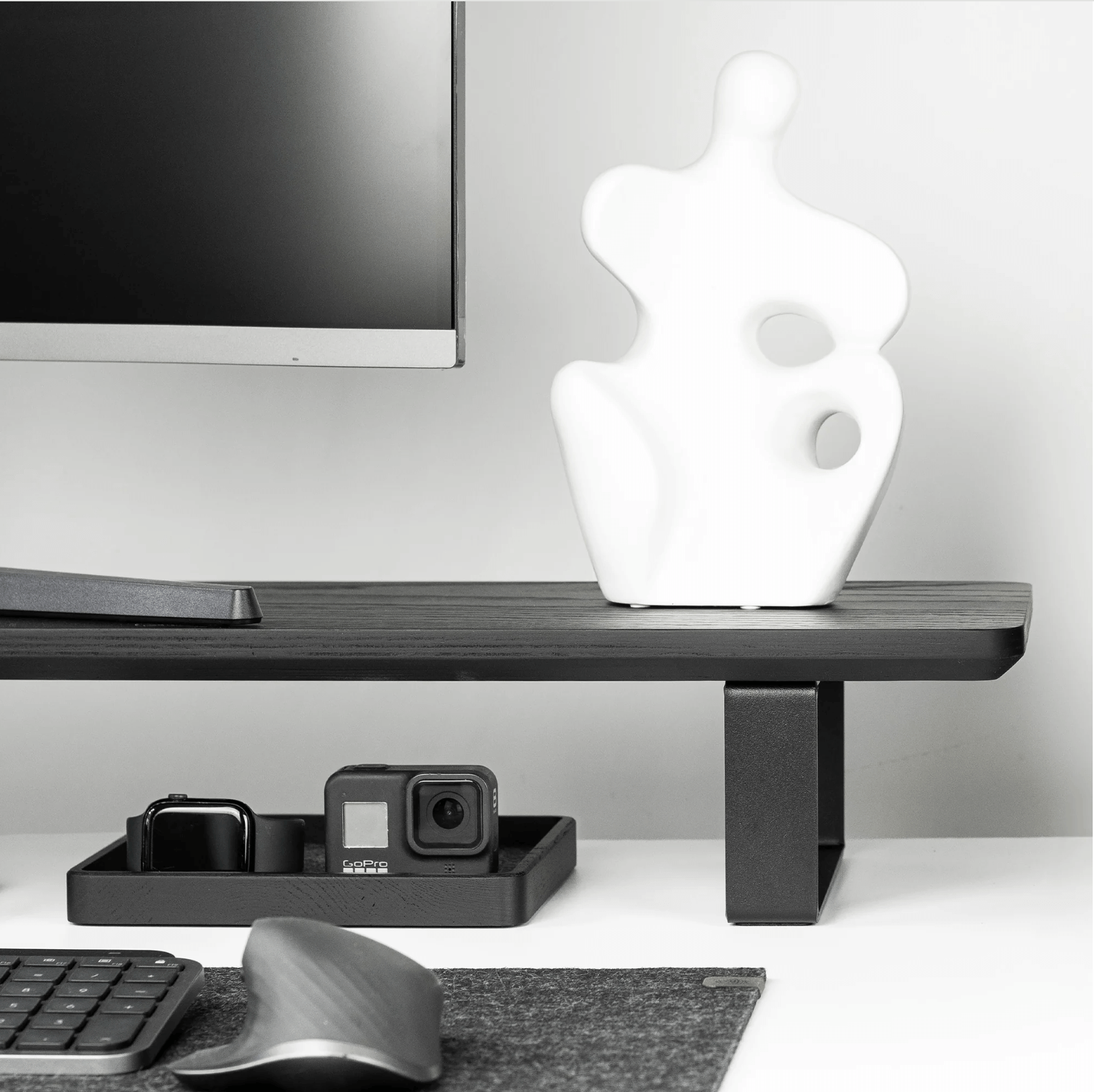 Black wooden Monitoe Stand side angle shot with storage underneath